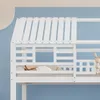 A close-up view of a white bunk bed with a house-shaped roof, set against a blue wall. Produktbild-Vorschau