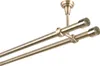 A double curtain rod with antique gold finish, mounted to a ceiling. Anteprima dell’immagine prodotto