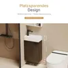 A compact bathroom vanity with a sink and faucet, next to a toilet, with text overlays highlighting its space-saving design. Náhled obrázku produktu