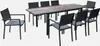An outdoor dining set with a table and chairs on a white background. Anteprima dell’immagine prodotto