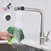A person is washing broccoli under a kitchen faucet. Podgląd zdjęcia produktu