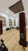 A room with acoustic panels on the ceiling and walls, and large speakers. The floor is made of light wood. Náhľad obrázku produktu