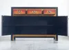An open oriental-style sideboard with three drawers at the top and two cabinet doors at the bottom, set against a plain background. Produktbild-Vorschau