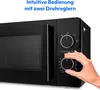 Close-up of a black microwave with a hand adjusting a dial. Text overlay advertises intuitive operation. Produktbild-Vorschau