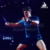 A young man playing table tennis with a dark background and purple light effects. Produktbild-Vorschau