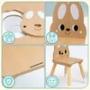 A collage of four images showing details of a wooden children's table and chair set with a bunny design. Produktbild-Vorschau