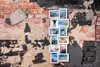 A collage of framed photos is displayed on a distressed brick wall. Anteprima dell’immagine prodotto