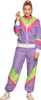 A woman is posing in a colorful tracksuit. Produktbild-Vorschau