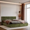 A green upholstered bed with pillows and a throw is shown in a bedroom setting. Anteprima dell’immagine prodotto