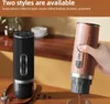 Two portable coffee makers are displayed on a wooden surface, with one being held by a hand and dispensing coffee. Produktbild-Vorschau