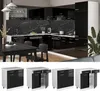 A modern black and white kitchen with a dining table and chairs, and a separate row of modular kitchen cabinets below. Voir les images du produit