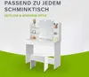 A white vanity table with a mirror and a stool, set against a light gray and white background with a green foreground. Náhľad obrázku produktu