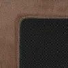 A close-up view of the corner of a rug, showing the textured top surface and the non-slip backing with white dots. Podgląd zdjęcia produktu