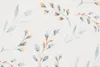 A close-up view of a fabric pattern with watercolor-style leaves and branches. Produktbild-Vorschau