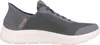 A side view of a gray Skechers slip-on sneaker with a white sole. Anteprima dell’immagine prodotto
