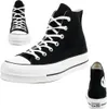 A studio shot of black Converse Chuck Taylor All Star platform high-top sneakers. Voir les images du produit