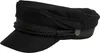 A black sailor cap with a rope detail and a small shield emblem on the side. Produktbild-Vorschau
