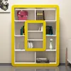 A modern, yellow-trimmed bookshelf filled with books and decorative items. Anteprima dell’immagine prodotto