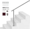 A handrail system installed on a set of stairs, with installation accessories laid out to the side. Podgląd zdjęcia produktu