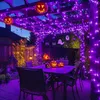 A decorated patio with Halloween-themed lights and pumpkins. Produktbild-Vorschau