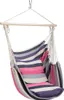 A striped hanging chair with a pillow. Podgląd zdjęcia produktu