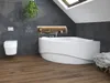 A modern bathroom with a large corner bathtub, a wall-mounted toilet, and dark gray tiled walls. Produktbild-Vorschau