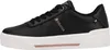A side view of a black sneaker with a white sole. Náhled obrázku produktu