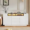 A modern white and black sideboard with LED lighting in a well-lit room. Produktbild-Vorschau