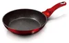 A red frying pan with a speckled black interior and a red handle, shown against a white background. Voir les images du produit