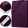 A collage of images showing a purple fitted sheet, with close-ups of the fabric texture and a label. Produktbild-Vorschau