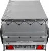 The rear view of a trailer covered with a gray tarp. Podgląd zdjęcia produktu