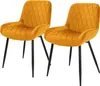 Two mustard yellow velvet dining chairs with black metal legs are shown against a white background. Náhľad obrázku produktu