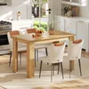 A dining table and chairs set in a bright, modern kitchen. Náhled obrázku produktu