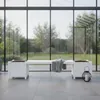 A white wooden bench with two integrated planters sits on a tiled patio in front of a large glass wall overlooking a garden. Anteprima dell’immagine prodotto