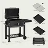 A charcoal grill with various dimensions and accessory measurements shown. Produktbild-Vorschau