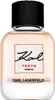 A perfume bottle with a black cap and a light pink liquid inside. The bottle has a label with the brand name and location. Podgląd zdjęcia produktu