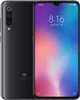 A black Xiaomi Mi 9 smartphone is shown from the front and back, displaying its screen with the time and date. Produktbild-Vorschau