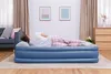 A person sleeping on an inflatable mattress in a bedroom. Produktbild-Vorschau