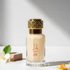 A perfume bottle with decorative elements and a flower. Voir les images du produit