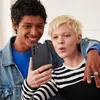 Two young people taking a selfie with a smartphone. Náhľad obrázku produktu