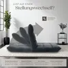 A dark gray floor chair is shown in various reclining positions on a rug, with a plant and a side table in the background. Text overlays describe features. Náhled obrázku produktu
