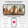 A smartphone displaying a robot vacuum cleaner's interface with a dog in the background, surrounded by feature descriptions. Produktbild-Vorschau