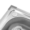 A close-up view of a stainless steel sink corner with a drain. Podgląd zdjęcia produktu