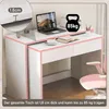 A white desk with pink trim, a laptop, a book, and a cup on it, with a pink chair nearby. Anteprima dell’immagine prodotto