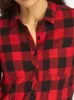 Close-up of a woman wearing a red and black checkered flannel shirt. Náhled obrázku produktu