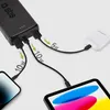 A black power bank is shown charging multiple devices, including a smartphone, a tablet, and wireless earbuds. Náhľad obrázku produktu