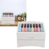 A piano-shaped calendar box with colorful keys. Produktbild-Vorschau