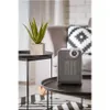 A modern living room setting with a heater on a coffee table. Voir les images du produit
