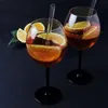 Two glasses of Aperol Spritz with orange slices and straws on a dark background. Podgląd zdjęcia produktu
