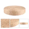 A round, thick pouf cushion made of woven straw-like material, shown from multiple angles. Voir les images du produit